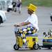 Michigan fan Todd Schultz, of Bedford, rides on a cooler scooter with a three trumpet train horn while tailgating outside of Michigan Stadium on Saturday, September 7, 2013. Melanie Maxwell | AnnArbor.com